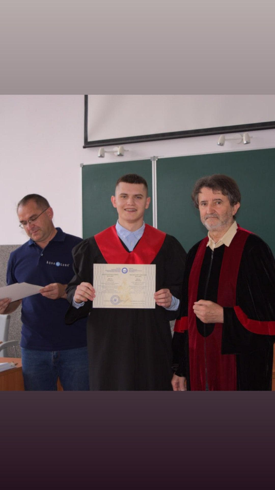 Graduation photo with Dean and diploma